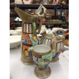 A COLLECTION OF H J WOOD POTTERY TO INCLUDE TWO JUGS AND A GOBLET DECORATED WITH EMBOSSED SCENES