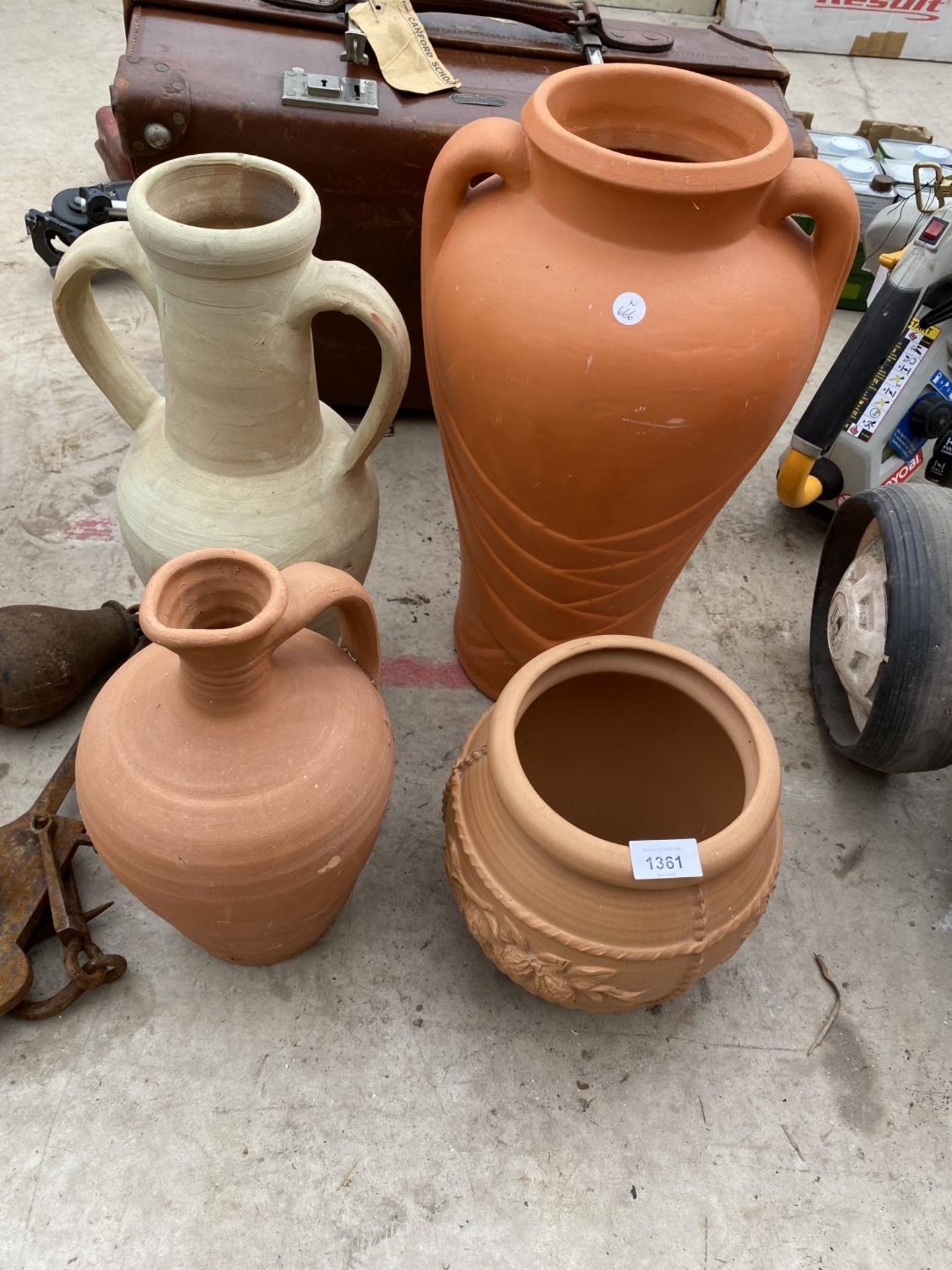 A TERRACOTTA PLANTER, A TERRACOTTA JUG AND TWO TERRACOTTA URNS