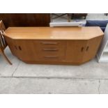 A RETRO G-PLAN SIDEBOARD ENCLOSING FOUR CUPBOARDS AND THREE DRAWERS, 72" WIDE