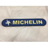 A CAST BLUE AND YELLOW 'MICHELIN' SIGN 49.5CM X 9CM