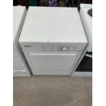 A WHITE MIELE TUMBLE DRYER BELIEVED IN WORKING ORDER BUT NO WARRANTY
