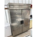 AN INDUSTRIAL STAINLESS STEEL FRIDGE UNIT