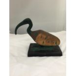 A CERAMIC PREHISTORIC LOOKING BIRD ON A BASE HEIGHT 20CM, LENGTH 21CM