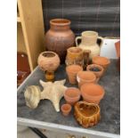 AN ASSORTMENT OF CERAMIC AND TERRACOTTA POTS, VASES AND URNS ETC