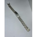 A HEAVY HALLMARKED LONDON SILVER IDENTITY BRACELET