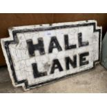 A VINTAGE CAST IRON 'HALL LANE' ROAD SIGN