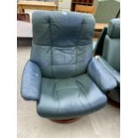 A GREEN STRESSLESS REVOLVING RECLINER