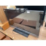 A SONY 32" TELEVISION WITH REMOTE CONTROL