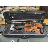 A VIOLIN WITH TWO BOWS AND ACCESORIES IN A FITTED CASE