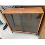 A RETRO TEAK BOOKCASE WITH SMOKED GLASS SLIDING DOOR 36" WIDE