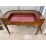 A 19TH CENTURY STYLE MAHOGANY AND CROSSBANDED CARLTON HOUSE DESK ENCLOSING NINE SMALL AND ONE LONG
