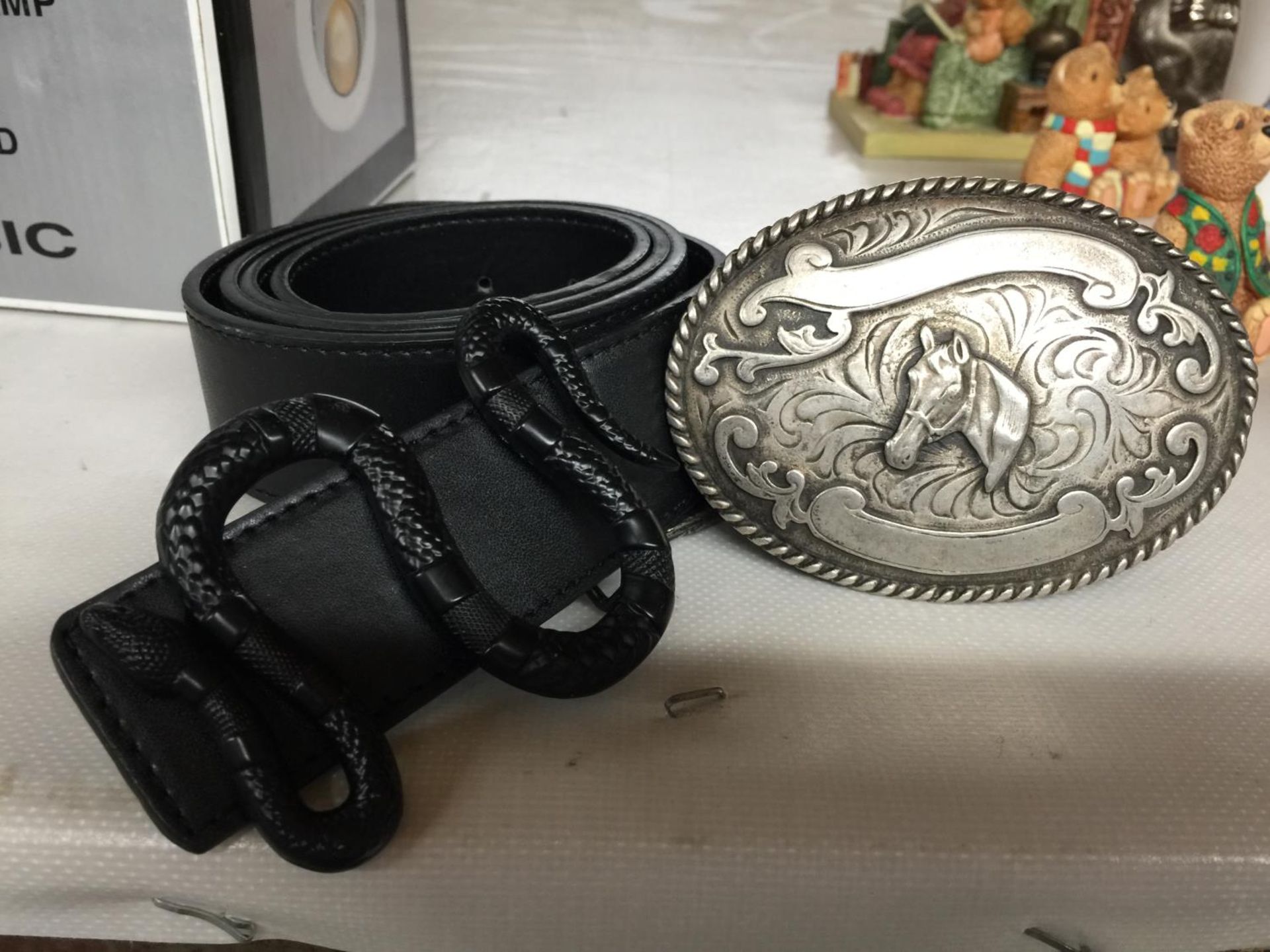 TWO LEATHER BELTS WITH DECORATIVE BUCKLES TO INCLUDE A HORSE AND A SNAKE