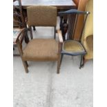 A MID 20TH CENTURY LOW FIRESIDE CHAIR AND EBONISED BEDROOM CHAIR