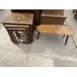 A NEST OF THREE OAK TABLES AND A BEECH COFFEE TABLE