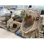 A LARGE CHAINSAW CARVING OF A BEACH MONSTER ENTITLED 'THE MOUTH'