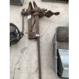 A LARGE VINTAGE CAST IRON LEG VICE