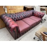 AN OXBLOOD CHESTERFIELD THREE SEATER SETTEE