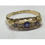 AN 18 CARAT GOLD RING WITH TWO DIAMONDS AND THREE SAPPHIRES IN LINE SIZE J (BAND WORN THIN AND A/