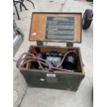 A VINTAGE WOODEN CASED FIELD TELEPHONE