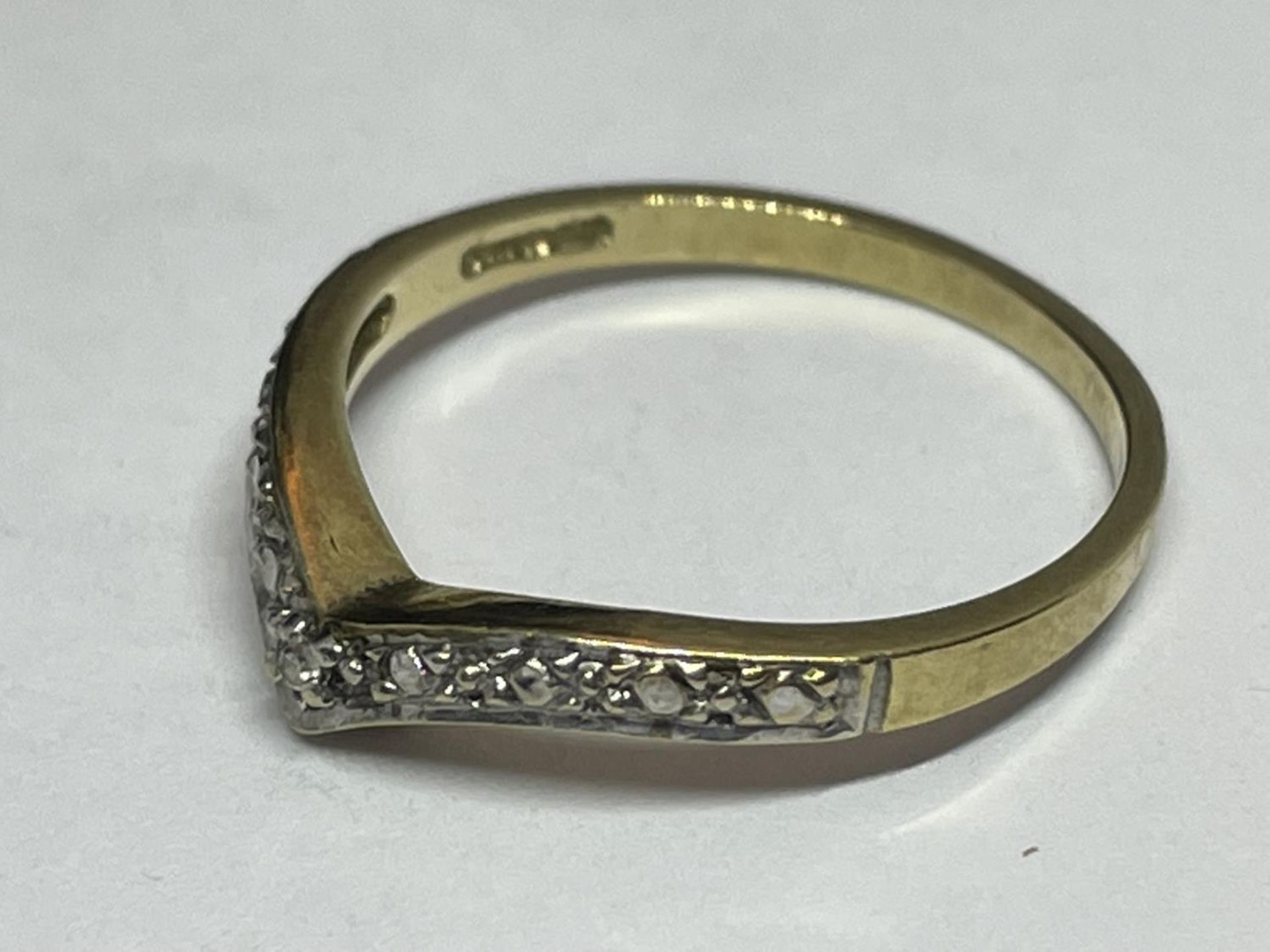 A 9 CARAT GOLD RING WITH DIAMONDS IN A WISHBONE DESIGN SIZE K - Image 2 of 4