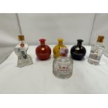SIX VARIOUS BOTTLES OF CHINESE SPIRIT THREE IN COLOURFUL CERAMIC BOTTLES WITH FLORAL DECORATION