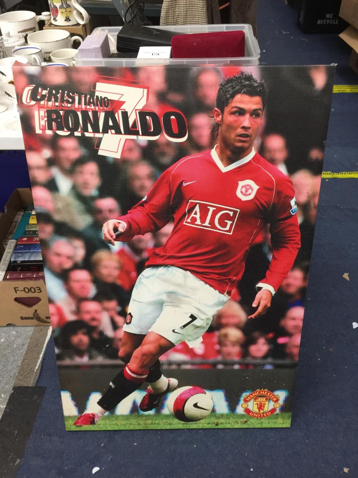 A LARGE WALL CANVAS OF CRISTIANO RONALDO PLAYING FOR MANCHESTER UNITED H: 92 CM