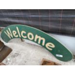 AN ARCHED WELCOME SIGN