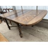 AN EARLY 20TH CENTURY OAK DRAW-LEAF DINING TABLE ON BARLEYTWIST LEGS