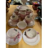 A QUANTITY OF WADE PINK AND FLORAL TEAWARE TO INCLUDE TRIOS, CREAM JUG, SUGAR BOWL, AND SANDWICH