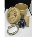 A BOXED KAHUNA WRIST WATCH WITH BRACELET SEEN WORKING BUT NO WARRANTY