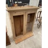 A VICTORIAN PINE TWO DOOR GLAZED BOOKCASE, 45" WIDE