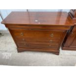A 19TH CENTURY STYLE CHERRY WOOD MONTSOREAU CHEST OF THREE GRADUATED DRAWERS, WITH SECRET FRIEZE