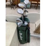 A GOLF BAG CONTAINING AN ASSORTMENT OF GOLF CLUBS