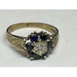 A 9 CARAT GOLD RING WITH A CENTRE DIAMOND SURROUNDED BY SAPPHIRES SIZE N/M