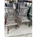 A SET OF SIX TEAK FOLDING GARDEN CHAIRS