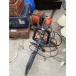 A GARDENA ELECTRIC LONG REACH HEDGE TRIMMER AND AN EXTENSION LEAD