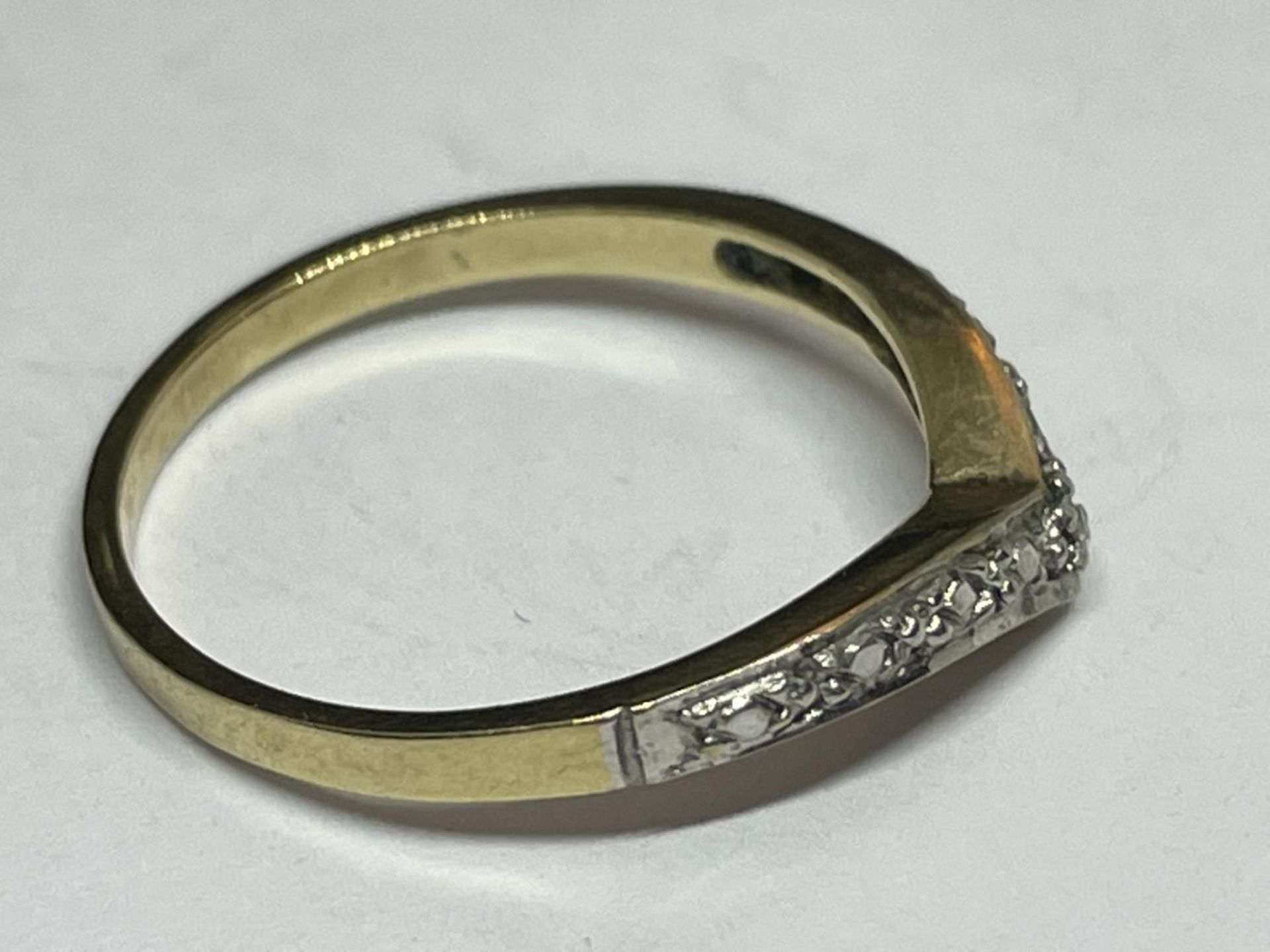 A 9 CARAT GOLD RING WITH DIAMONDS IN A WISHBONE DESIGN SIZE K - Image 4 of 4