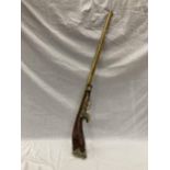 A DECORATIVE ORNAMENTAL BRASS MUSKET