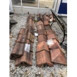 A QUANTITY OF TERRACOTTA RIDGE TILES