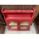 A MODERN RED PAINTED TWO DOOR WALL CABINET, 32.5" WIDE