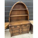 AN OAK OLD CHARM DUTCH STYLE DRESSER WITH BOAT SHAPED PLATE RACK