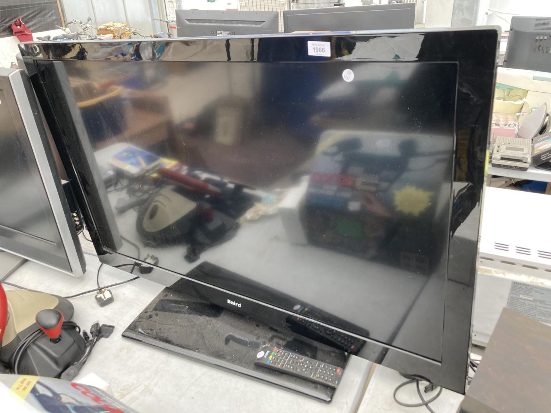 A BAIRD 46" TELEVISION WITH REMOTE CONTROL