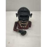 A VINTAGE 'JOLLY MAN' MONEY BOX IN WORKING ORDER