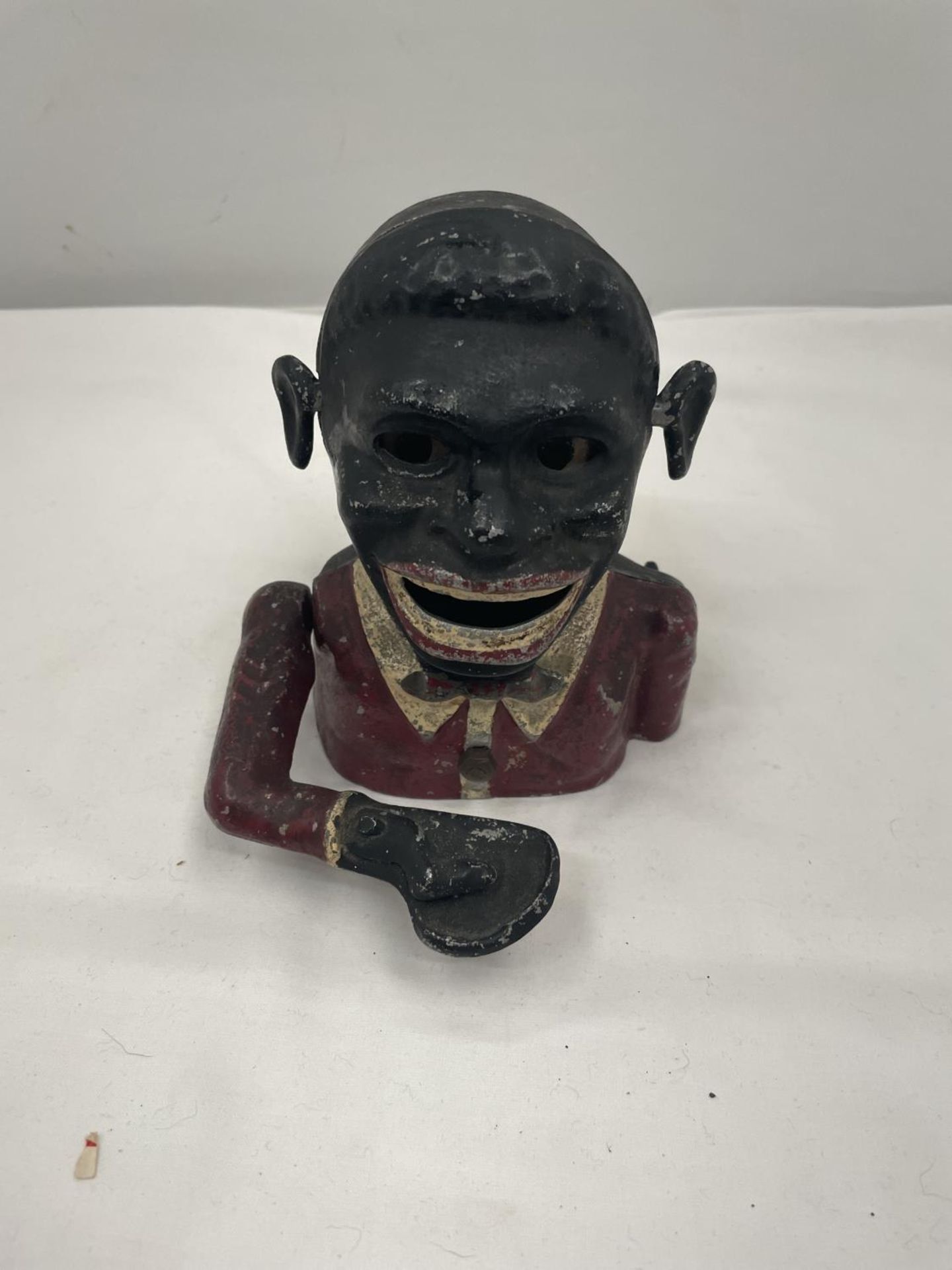 A VINTAGE 'JOLLY MAN' MONEY BOX IN WORKING ORDER