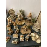 A COLLECTION OF PENDELFIN RABBITS AND STANDS