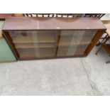 A MID 20TH CENTURY BOOKCASE WITH FOUR SLIDING DOORS BY B&S GOODMAN LTD, LONDON (ROSEBERRY), 54" WIDE