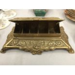 A BRASS STAMP BOX WITH ORNATE STYLE DECORATION