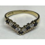 A 9 CARAT GOLD WISHBONE RING WITH FIVE SAPPHIRES AND FOUR CUBIC ZIRCONIAS SIZE L