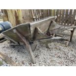 A WOODEN WHEELBARROW A/F