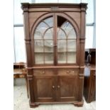 A 19TH CENTURY MAHOGANY AMERICAN FULL LENGTH CORNER CUPBOARD WITH ARCHED AND GLAZED UPPER PORTION